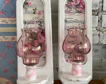 Distressed white wood candle sconce pair, rose floral center, pink glass fluted candle cups