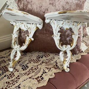 A pair of baroque wall, gold and white distressed French wall hanging