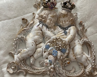 A unique and rare style cherub wall plaque, wall collection