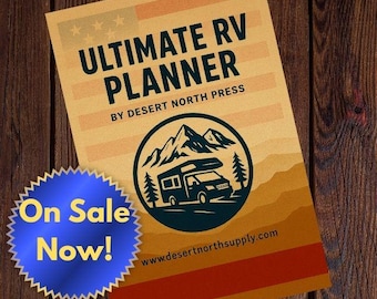 May include: A planner titled "Ultimate RV Planner" with a logo of a camper van in front of mountains and trees. The planner has a beige and orange color scheme with the text "On Sale Now!" on a blue sticker.