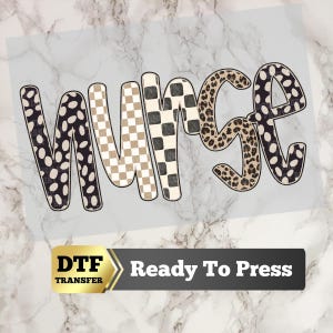 May include: A DTF transfer sheet featuring the word NURSE in large, rounded letters. Each letter has a distinct pattern: black and white spots, beige and white checkerboard, black and white checkerboard, leopard print, and black and white spots.