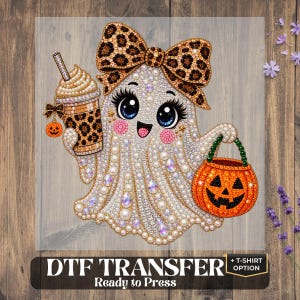May include: A DTF transfer featuring a cartoon ghost adorned with a large leopard print bow, holding a leopard print iced coffee cup and an orange jack-o'-lantern candy bucket. The design is embellished with sparkling rhinestones and pearls.