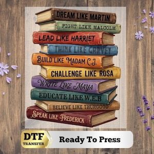 May include: A stack of ten books with colorful covers, each featuring black text: Dream Like Martin, Fight Like Malcolm, Lead Like Harriet, Think Like Garvey, Build Like Madam C.J., Challenge Like Rosa, Write Like Maya, Educate Like W.E.B, Believe Like Thurgood, and Speak Like Frederick.