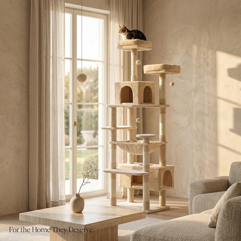 May include: A multi-level beige cat tree with multiple platforms, cubby holes, and a hammock. A brown and black cat sits atop the highest platform. The text "For the Home They Deserve" is at the bottom of the image.