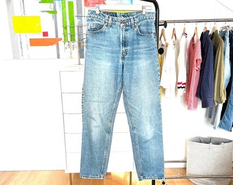 Vintage Levi's 550 Orange Tab Medium Wash Denim Patched Distressed High Waisted Tapered Leg Jeans // Measures 26/27 x 29