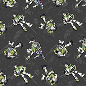 May include: A dark grey fabric featuring a repeating pattern of Buzz Lightyear in his white, green, and purple space ranger suit. The design includes line art illustrations of planets, stars, and wings scattered between the colourful characters.