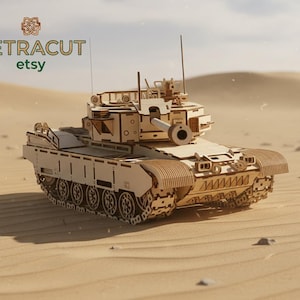May include: A detailed wooden model of a tank, displayed on a sandy surface. The model has a turret, tracks, and a gun barrel. The Etsy shop name, VETRACUT, is visible in the top left corner. The background shows a desert landscape.
