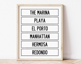 May include: A black and white printable wall art print with the words "The Marina", "Playa", "El Porto", "Manhattan", "Hermosa", and "Redondo" in a simple, modern font.
