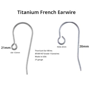 May include: Two silver titanium French earwires are displayed against a white background. The earwires are 21mm and 20mm in length, with a 1.5mm and 2mm hole. The text reads "Titanium French Earwire" and "Made in USA."