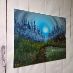 May include: An oil painting depicts a moonlit forest scene with a path leading to a small cabin. The sky is a gradient of blue and white, with a bright moon. The foreground features green and yellow foliage.