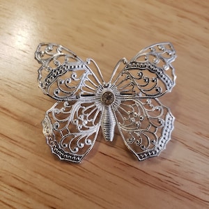 Vintage Rhinestone Butterfly Brooch, silver tone filigree butterfly pin with clear rhinestone, made in Germany