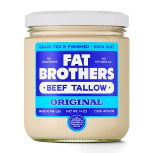 May include: A glass jar of Fat Brothers Beef Tallow, labeled "Original." The jar has a white lid and a light beige interior. The label is blue and white, with text indicating it is grass-fed, hormone-free, and antibiotic-free. Net weight is 14 oz.