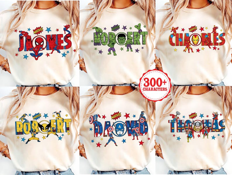 May include: Cream-colored t-shirts with personalized names in a Marvel comic book style. Each shirt features a different name, such as "James", "Robert", and "Charles", with corresponding superhero graphics and star accents.