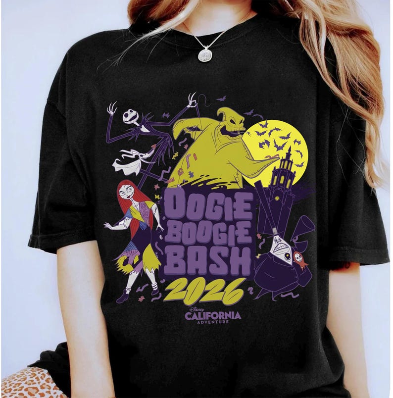 May include: Black t-shirt featuring characters from The Nightmare Before Christmas. The design includes Jack Skellington, Sally, Oogie Boogie, and the text "Oogie Boogie Bash 2026" with a California Adventure logo.