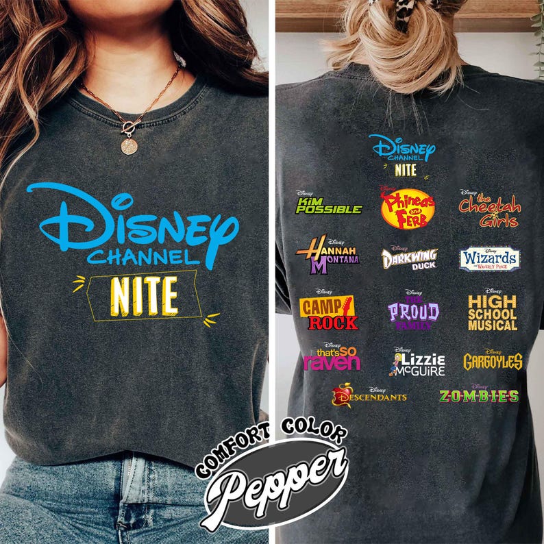 May include: Dark gray t-shirt featuring the Disney Channel logo in blue, with "NITE" in a yellow rectangle. The back displays logos from various Disney Channel shows like "Kim Possible," "Hannah Montana," and "High School Musical."