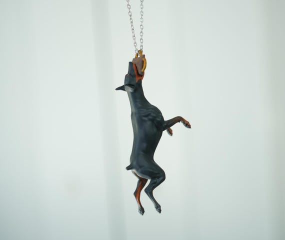 Car hanging ornament - Doberman catching a tug bite toy