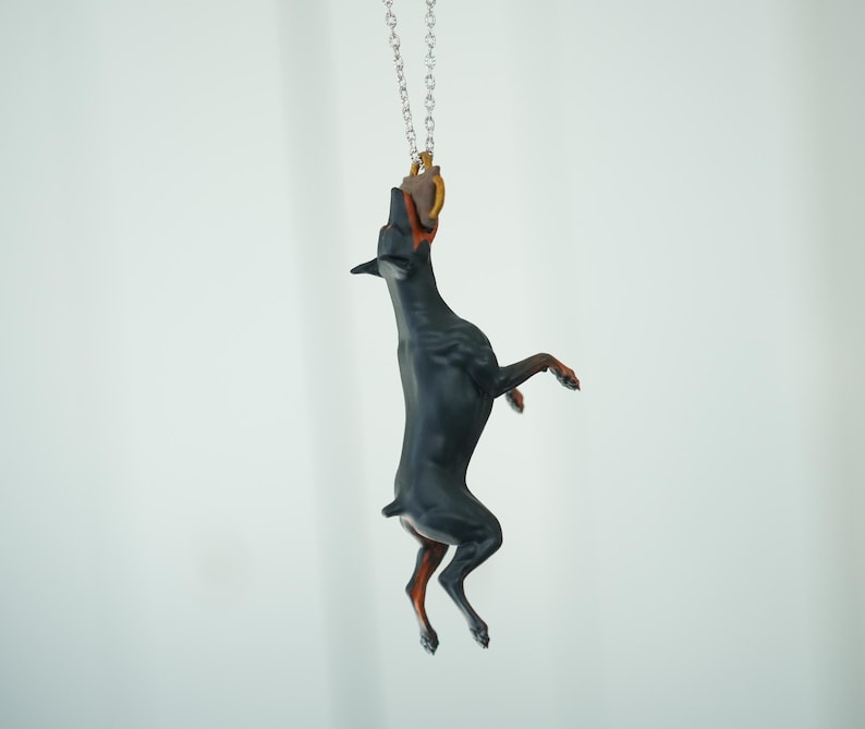 Car hanging ornament - Doberman catching a tug bite toy image 1