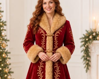May include: A long, deep red velvet coat featuring tan faux fur trim along the collar, cuffs, and hem. The coat is decorated with intricate gold embroidery in a scrolling vine pattern along the front panels and sleeves, secured by toggle closures.