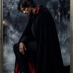 May include: A full-length black velvet cloak with a deep red satin lining and a high collar. The garment is worn over a black shirt and black trousers, featuring a structured drape that extends to the floor, creating a dark, layered appearance.