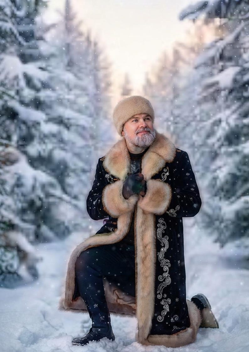 May include: A black long coat featuring light tan fur trim on the collar, cuffs, and hem, adorned with intricate silver embroidery. The garment is paired with a matching tan fur hat, creating a cohesive look for cold weather conditions.