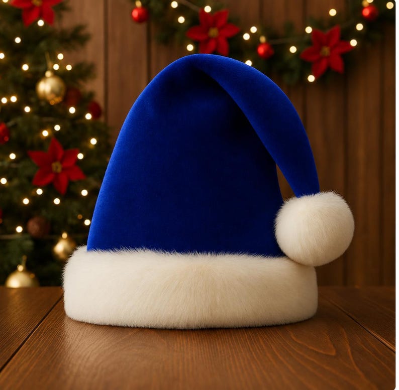 May include: A vibrant royal blue velvet Santa hat featuring a thick, plush white faux fur trim around the base and a matching white faux fur pom-pom attached to the tip of the folded top, creating a soft and textured appearance.