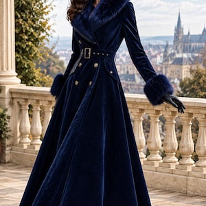May include: A floor-length navy blue velvet coat featuring a wide faux fur collar, matching faux fur cuffs, a double-breasted front with gold-toned buttons, and a belted waist. The coat is paired with black leather gloves and black high-heeled boots.
