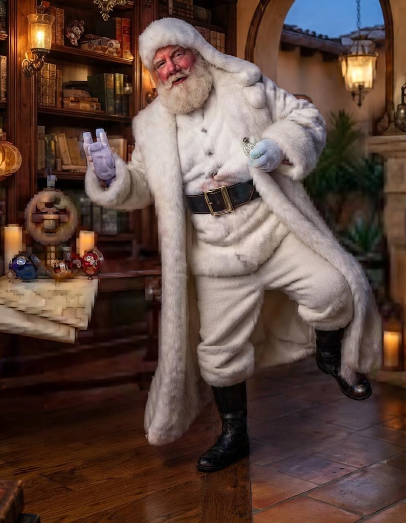 May include: A figure dressed in a long white faux fur coat, matching white trousers, and a white fur hat. The outfit includes a black leather belt with a gold buckle, black leather boots, and light blue gloves. The figure has a white beard.