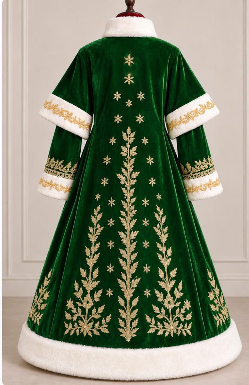 May include: A floor-length dark green velvet coat featuring a white faux fur collar, cuffs, and hem. The back is decorated with gold embroidered leaf patterns and snowflake motifs. The sleeves have layered cuffs with gold embroidery.