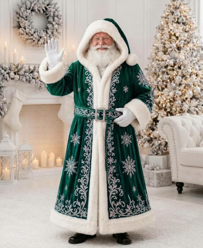 May include: A floor-length dark green velvet coat with a white faux fur hood, cuffs, and hem. The coat features intricate silver embroidery in snowflake and scroll patterns, a matching belt with a silver buckle, and white gloves.