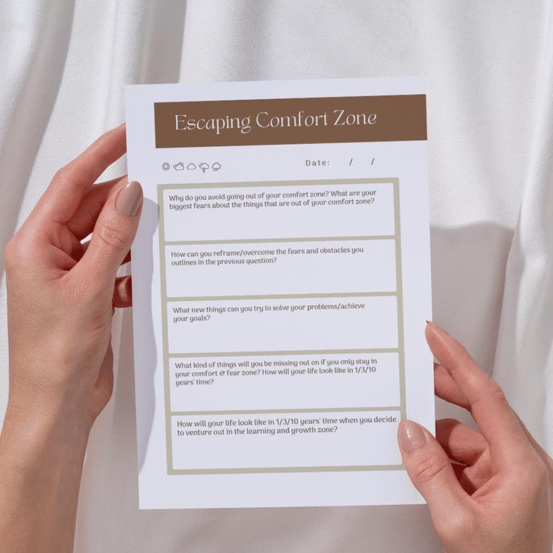 A person's hands holding a paper with a survey or question sheet titled "Escaping Comfort Zone".