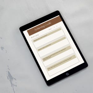 a tablet with a survey or goal-setting application open on its screen.