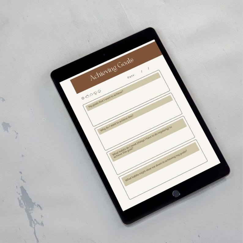 a tablet with a survey or goal-setting application open on its screen.
