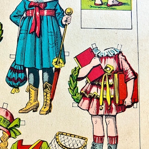 May include: Vintage paper dolls with outfits. One doll wears a teal coat with a red bow and belt, paired with yellow boots. Another doll is in a pink dress with a yellow sash, holding red books, and wearing gray boots. The image is a colorful illustration.