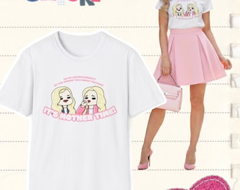 May include: White t-shirt with a cartoon graphic of two blonde women and the text "It's Mother Time!". The image also features a woman wearing a similar t-shirt and pink skirt, and the words "White Chicks".