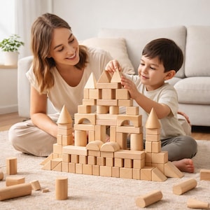 May include: A wooden block set being used to build a castle. The set includes various shapes like cubes, cylinders, and triangles. A woman and a child are building the castle together on a light-colored carpet.