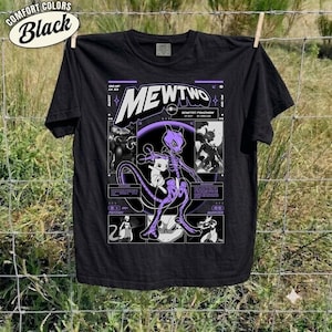 May include: A black short-sleeve t-shirt featuring a graphic print of the character Mewtwo. The design includes the text Mewtwo, Genetic Pokemon, and various character illustrations in purple and white tones, arranged in a grid-like layout.