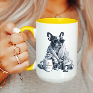 May include: White ceramic mug with a yellow interior and handle. The mug features a black and white illustration of a French Bulldog wearing sunglasses and a robe, with a small mug that says "Too Fancy to Fetch."