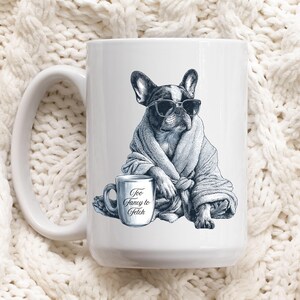 May include: White ceramic mug featuring a black and white illustration of a French Bulldog wearing sunglasses and a robe. The mug also has a smaller mug with the text "Too Fancy to Fetch".