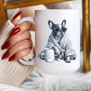 May include: White ceramic mug featuring a black and white illustration of a French Bulldog wearing sunglasses and a robe. The mug also has a smaller mug with the text "Too Fancy to Fetch".
