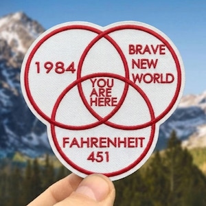 May include: A white patch with a red Venn diagram design. The circles contain the text "1984", "Brave New World", and "Fahrenheit 451". The overlapping section reads "You Are Here".