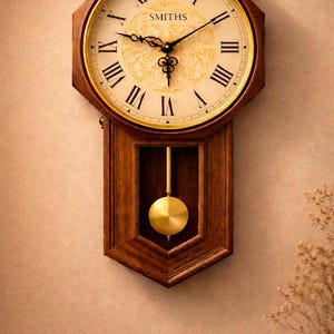 May include: A wooden wall clock with a pendulum. The clock face is cream-coloured with black Roman numerals and hands. The clock is in a wooden octagonal frame with the name "SMITHS" printed on the face. The pendulum is gold-coloured.