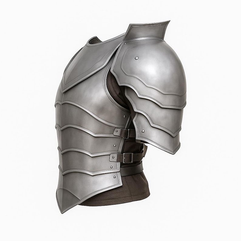 May include: A silver-colored medieval-style breastplate and shoulder armor. The armor has layered plates and is secured with buckles and straps. The design includes a raised collar and is set against a white background.