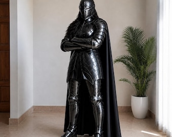 May include: A full suit of polished black metal armor featuring a segmented helmet, articulated shoulder and arm plates, a breastplate, and leg greaves. The armor is worn with a long, solid black cape that drapes down to the floor behind the figure.
