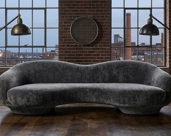 Sofá Nube Curva – Sofá moderno orgánico con diseño de guijarros, disponible en tela o cuero personalizados.