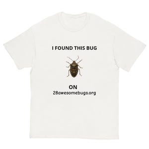 May include: White t-shirt featuring the text "I FOUND THIS BUG" and a brown bug illustration. Underneath, it reads "ON 28awesomebugs.org". A simple, unisex tee.