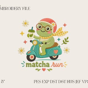 May include: An embroidery file design featuring a green frog wearing a red helmet, glasses, and a yellow scarf, riding a teal scooter while holding a matcha drink. The text "matcha run" appears below, surrounded by daisies, stars, and leaves.