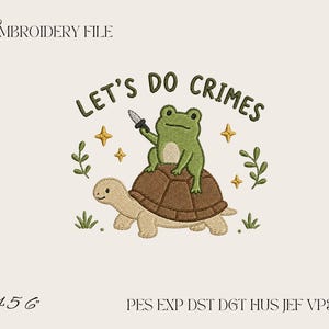 May include: An embroidery file design featuring a green frog holding a small knife while sitting on a brown turtle. The text LET'S DO CRIMES is arched above the frog, surrounded by small yellow stars and green leafy sprigs on a light background.