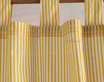 May include: Yellow and white striped curtain panels hanging from a wooden rod. The fabric features vertical stripes, creating a classic and bright design. The curtains are made of a lightweight material, suitable for various interior styles.