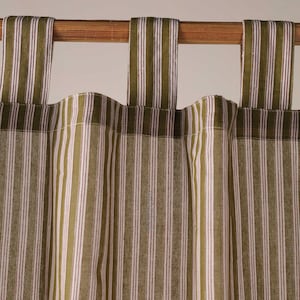 May include: Close-up of a green and white striped curtain panel with matching tab top. The curtain is made of a woven fabric with vertical stripes in olive green, white, and a thin red stripe. The curtain hangs from a wooden rod.