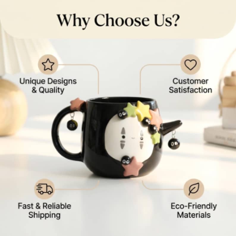 May include: A black ceramic mug featuring a white, oval-faced character with small black eyes and a subtle smile. The mug is decorated with pastel-colored stars and small black soot sprites, with two sprites dangling from the handle and side.